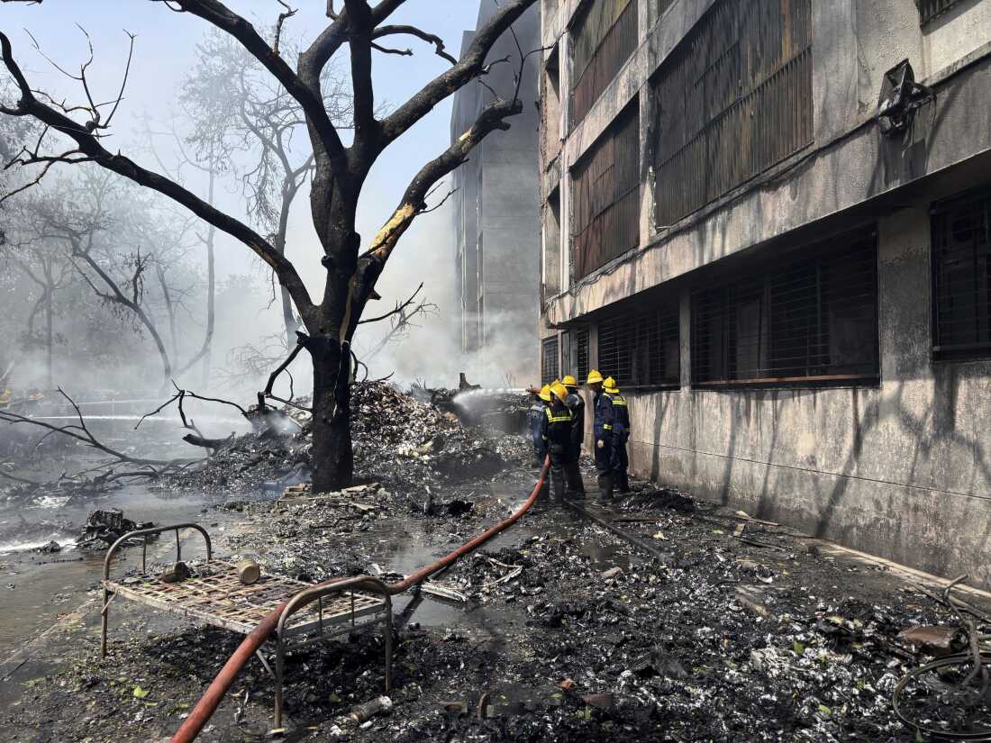 Firefighters work at the site of an airplane that crashed in India's northwestern city of Ahmedabad in Gujarat state, Thursday, June 12, 2025. (AP Photo/Ajit Solanki)